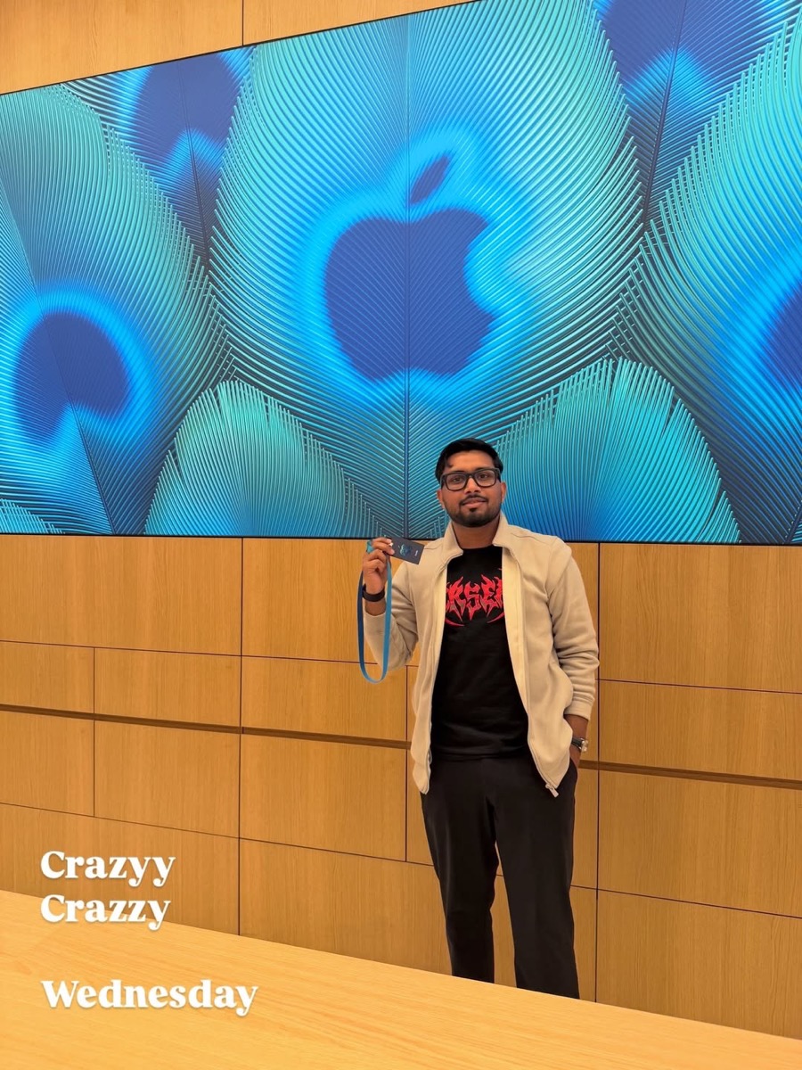 Manav at the Apple store launch in Noida, in front of the Apple wall